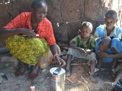 Veronica Ero in her house with her mobile